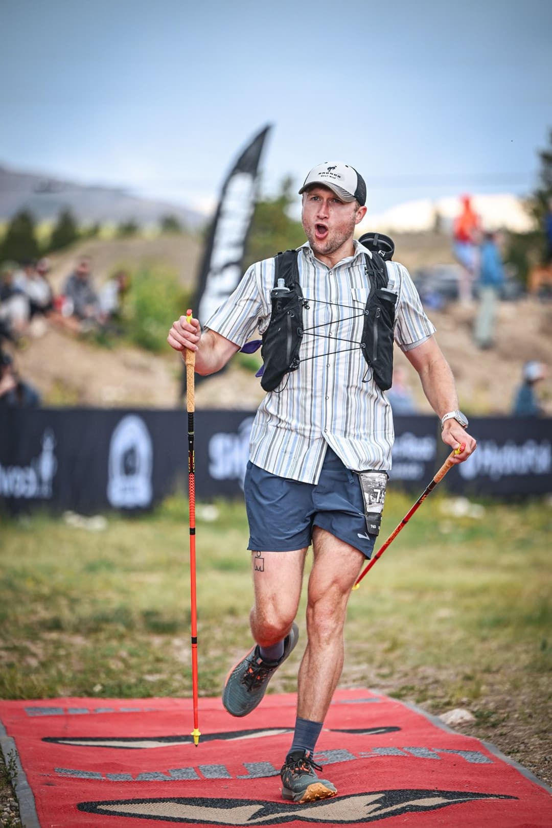 Kevin Rudd finishing a trail ultramarathon with poles in hand